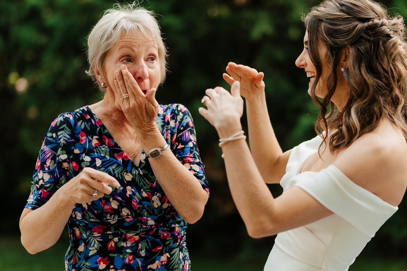 Harbor Springs Michigan wedding photographer candid mother of bride overcome with tears during emotional outdoor first look reaction, top Northern Michigan documentary wedding photography
