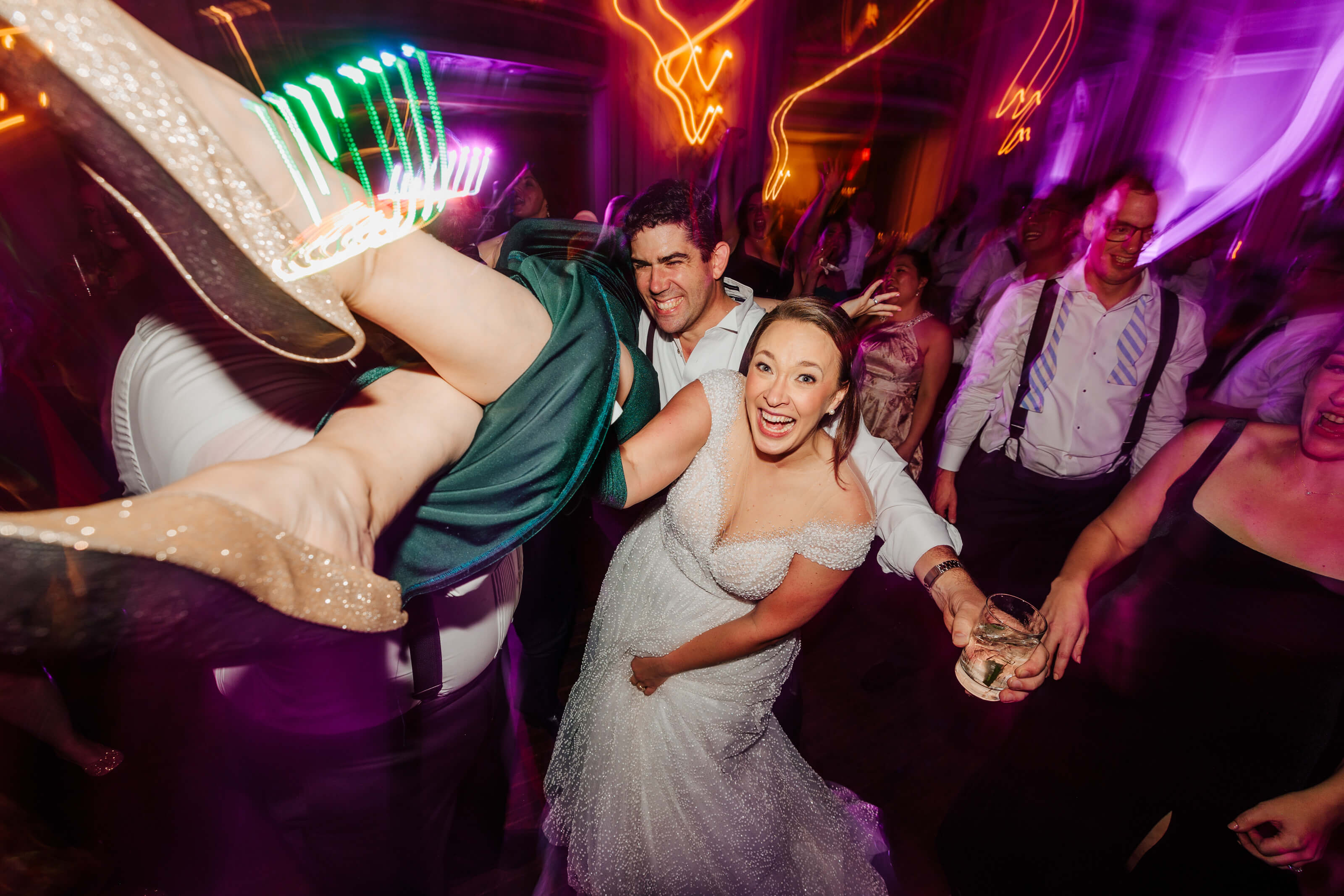 Colony Club wedding photographer Detroit Michigan candid bride dance floor neon lights dip