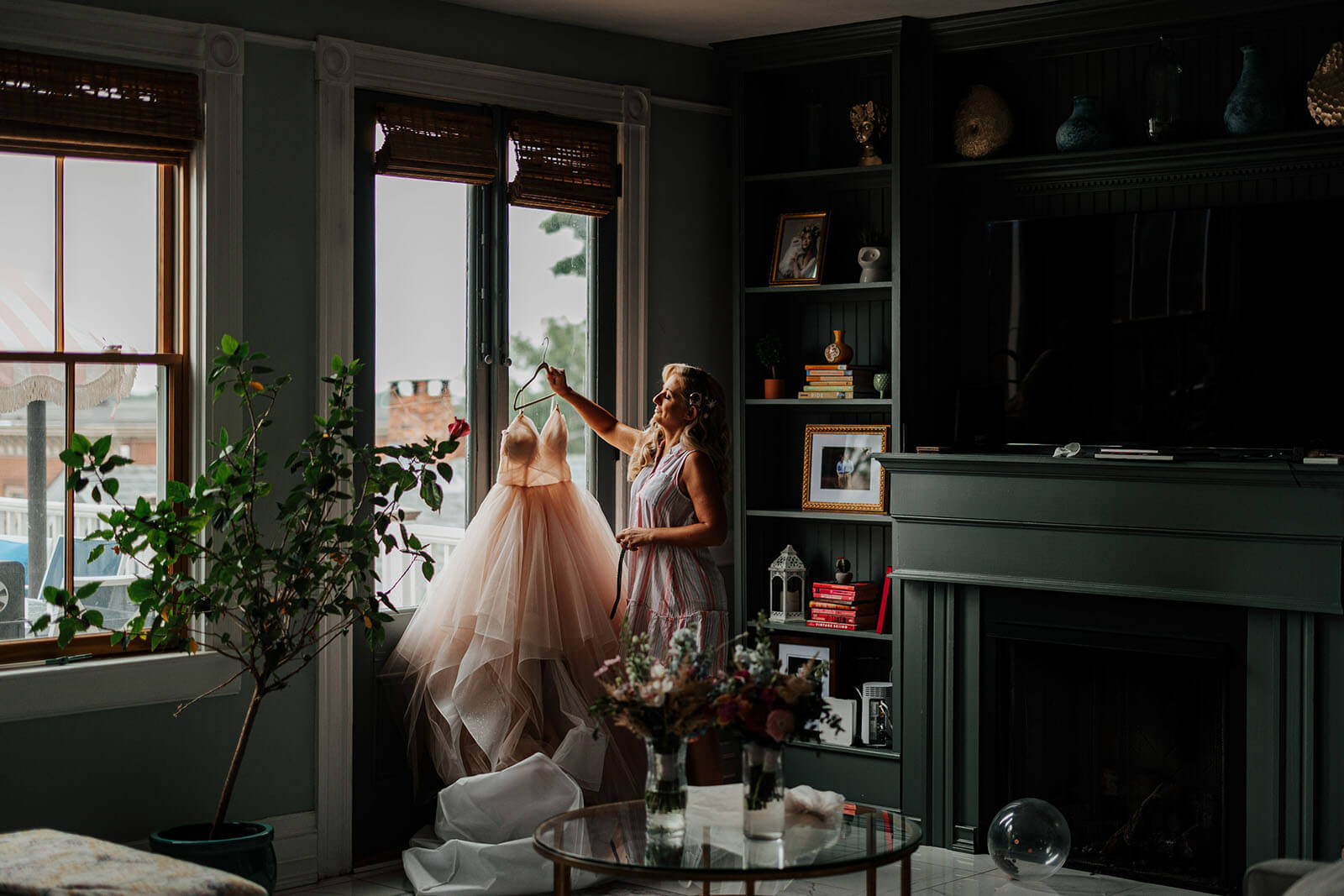 Bride and groom with corgi dogs on lawn during golden hour at Varnums House wedding in East Greenwich Rhode Island