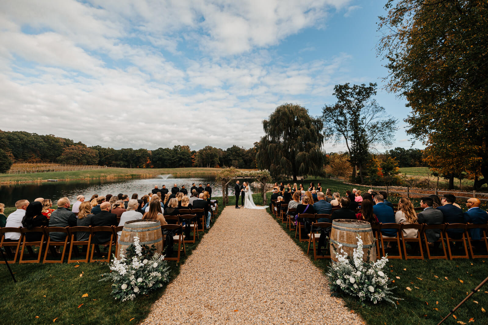Wide view of outdoor wedding ceremony with full guest seating at Westers Family Winery Junction Michigan