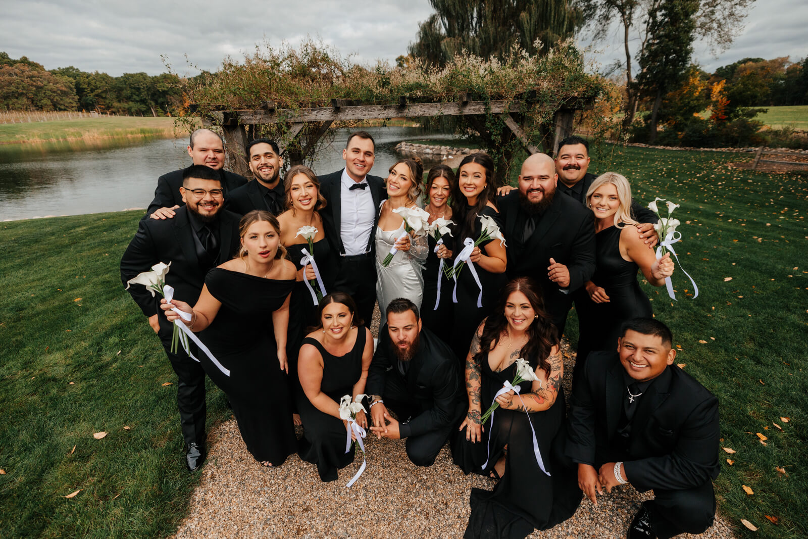 Full wedding party group portrait by the pond at Westers Family Winery October wedding