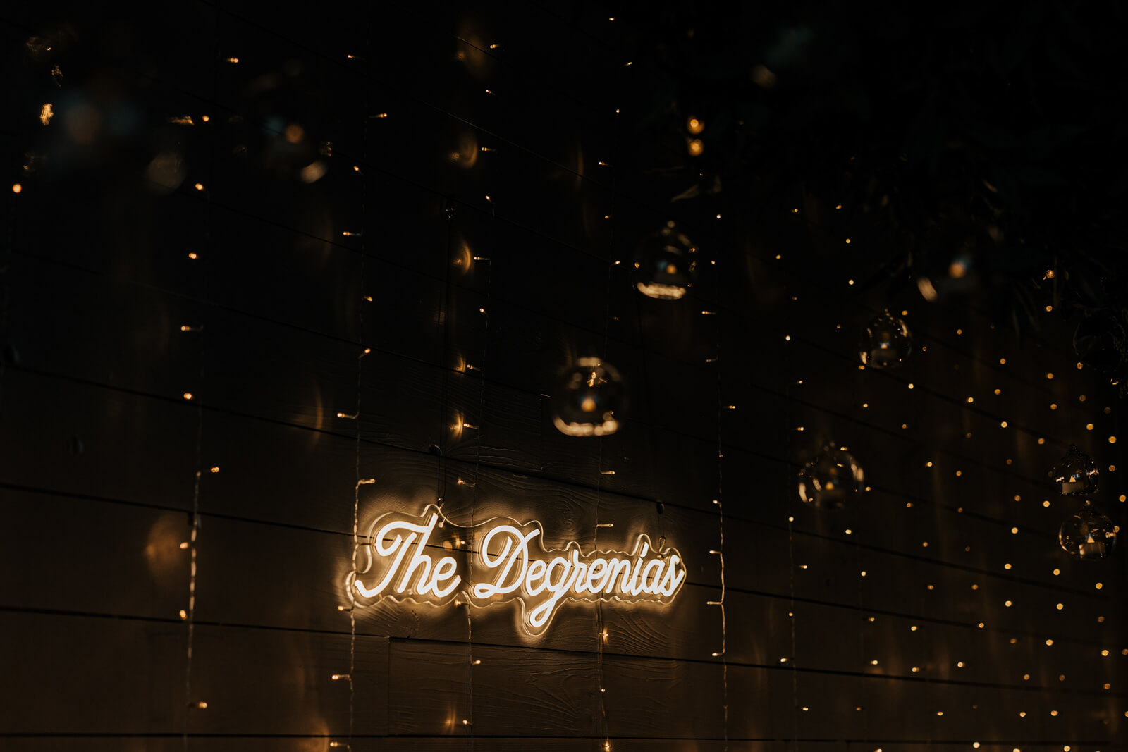 The Degrenias neon sign glowing at wedding reception at Westers Family Winery