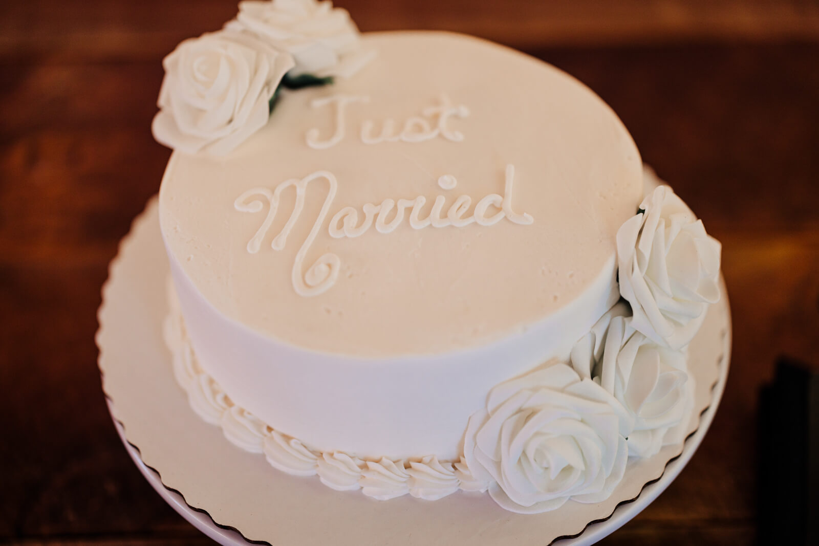 Just Married white wedding cake with roses at Westers Family Winery fall reception