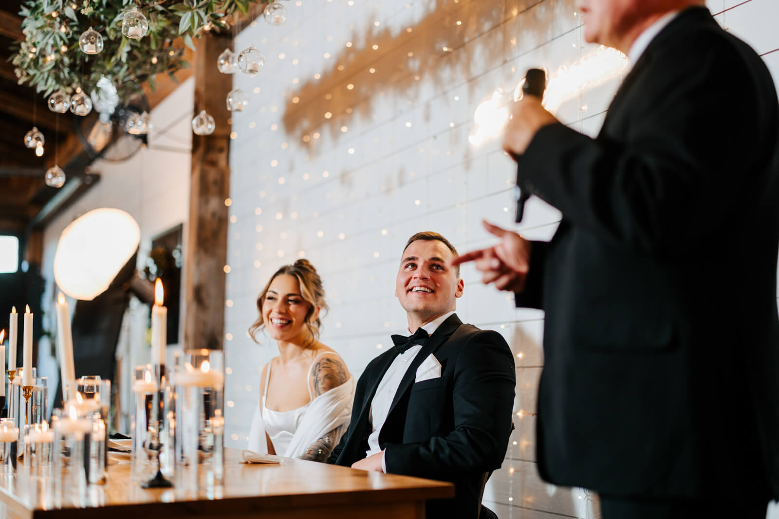 Groomsman giving wedding toast at bar area during Westers Family Winery reception