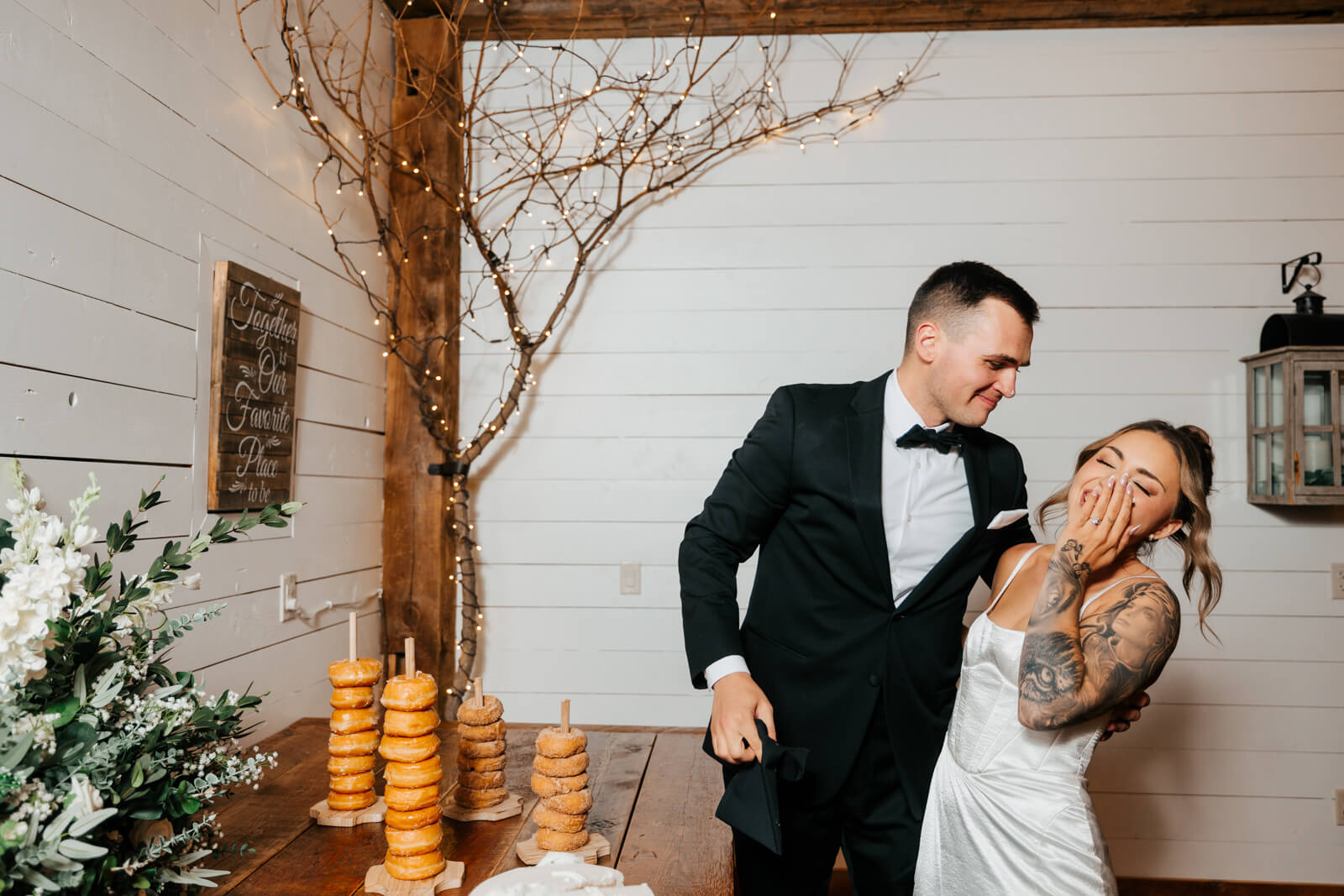 Bride and groom slow dancing together at fall winery wedding reception