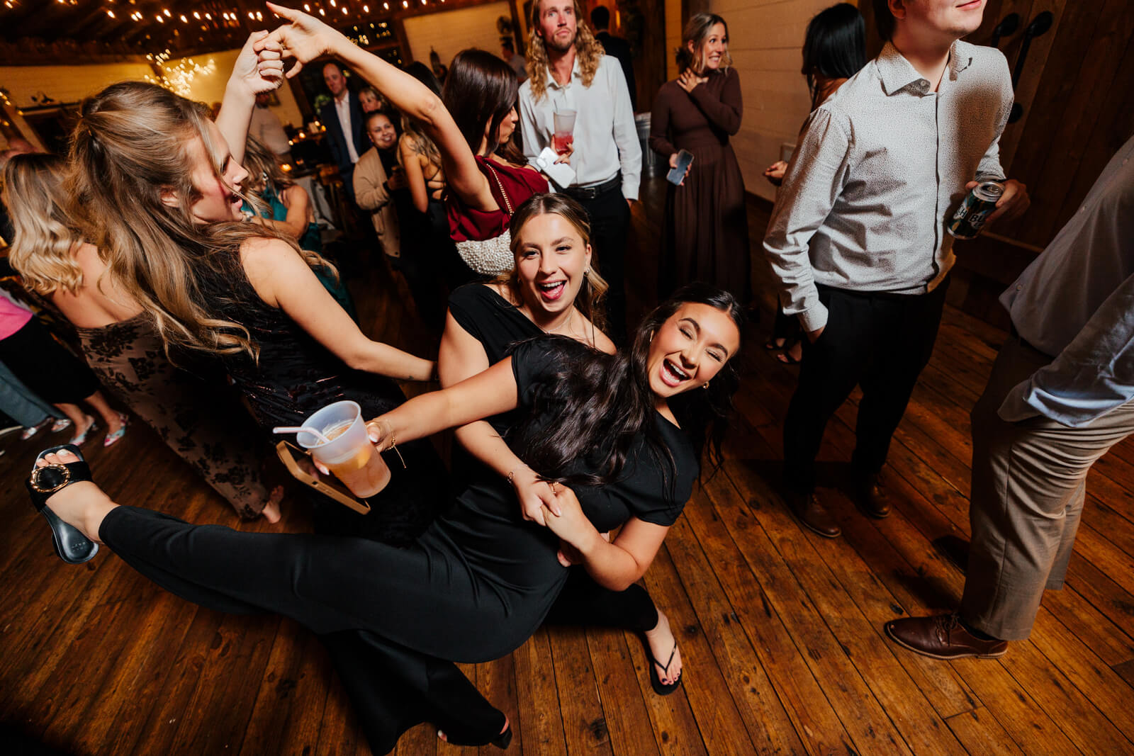 Wedding guests laughing and dancing together at Westers Family Winery October reception