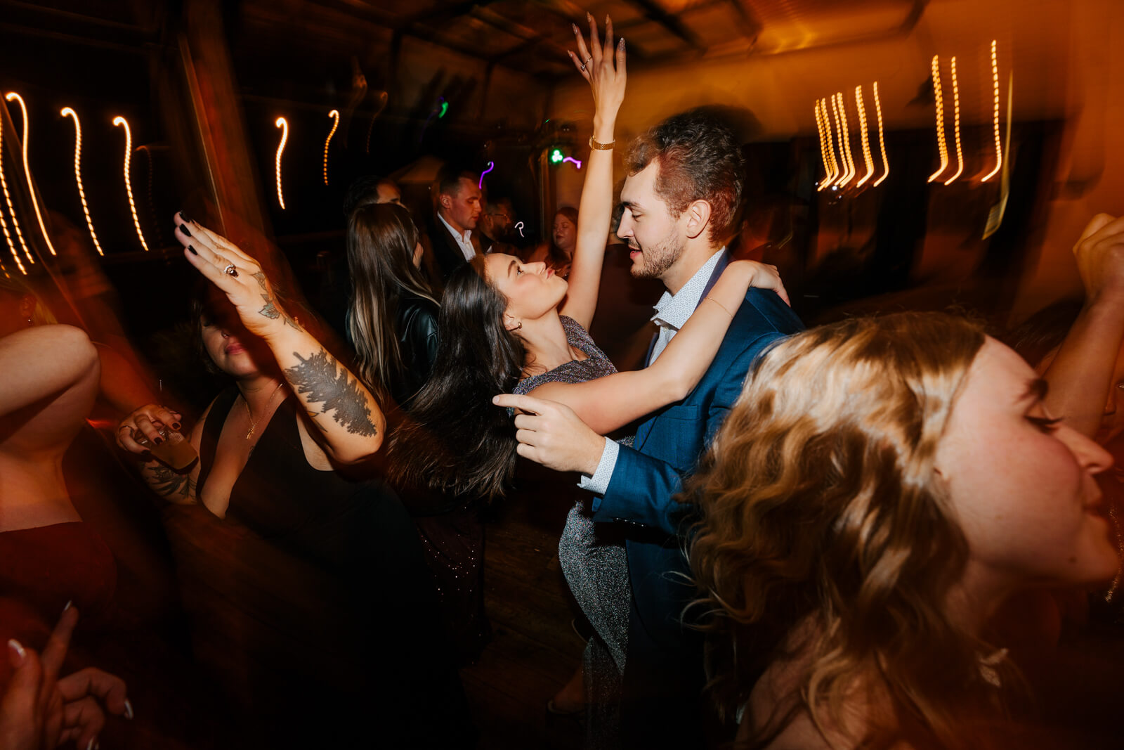 Bride in sunglasses dancing with groom at late-night Westers Family Winery wedding reception