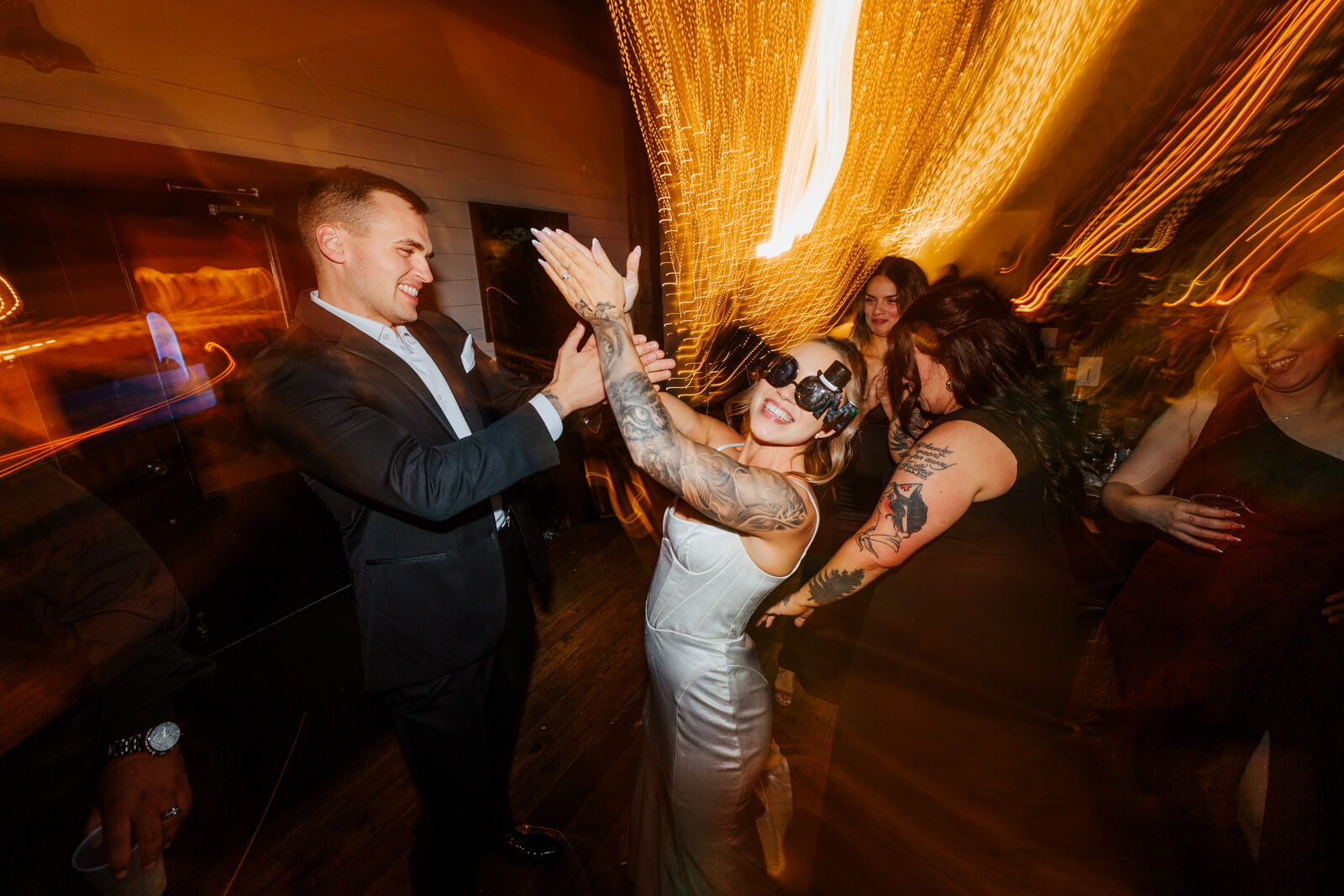 Wedding guests dancing with light painting effect at Westers Family Winery October reception