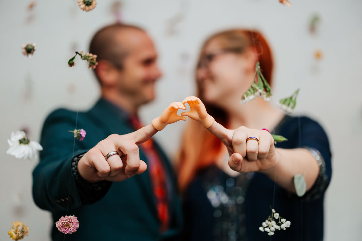 Bride and groom laughing together during confetti celebration at Michigan wedding