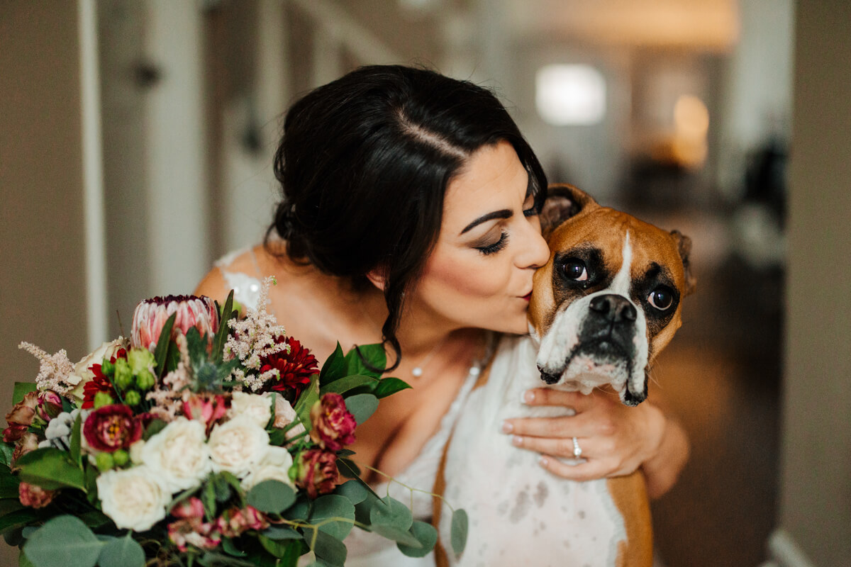 Bride holding lush floral bouquet at Michigan wedding photographed by GAUPERphoto