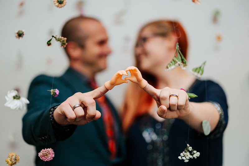 Bride and groom laughing together during confetti celebration at Michigan wedding