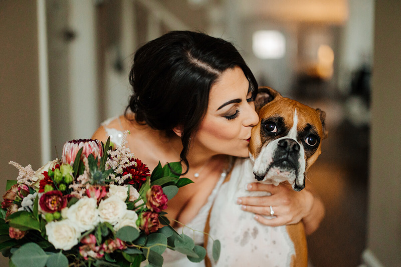 Bride holding lush floral bouquet at Michigan wedding photographed by GAUPERphoto